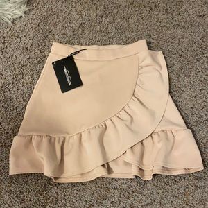 PRETTYLITTLETHING Tan Frill Hem Wrap Mini Skirt